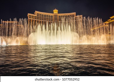 Las Vegas, Nevada, USA - December 29, 2017 : The Fountains of Bellagio at night. This feature performs choreography with water, music and light in front of the Bellagio hotel and casino.