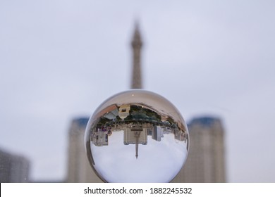 LAS VEGAS, NEVADA, USA - DECEMBER 24, 2020: Las Vegas Skyline Refracted Through Crystal Ball On Overcast Day