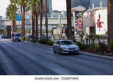 Las Vegas, Nevada, USA - June 3, 2022. Vehicle Traveling Down Empty Las Vegas Boulevard.   Palm Trees Line An Empty Street In Las Vegas. 