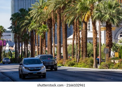 Las Vegas, Nevada, USA - June 3, 2022. Vehicles Traveling Down Empty Las Vegas Boulevard.   Palm Trees Line An Empty Street In Las Vegas