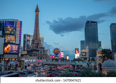 Las Vegas Nevada, USA. May 27, 2019. Las Vegas Strip Aerial View At Dusk. Colorful Neon Signs And Ads, Crowd And Cars, Cloudy Sky