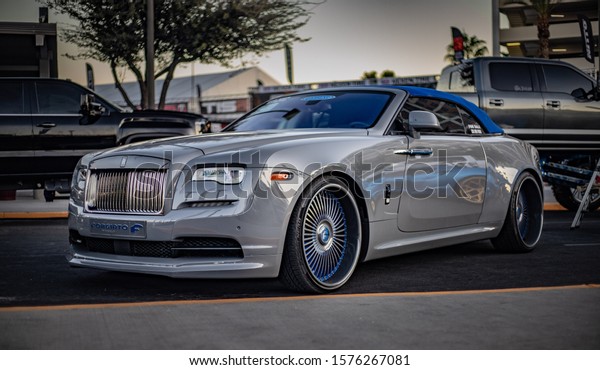 Las Vegas, Nevada / USA - November 7th, 2019 :\
Grey with blue convertible top Rolls Royce Dawn parked on the\
street.