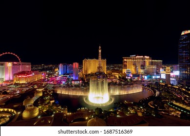 Las Vegas, Nevada, USA - October 31, 2019: Night view of Las Vegas Bellagio Hotel and Casino fountain and other hotels on Strip