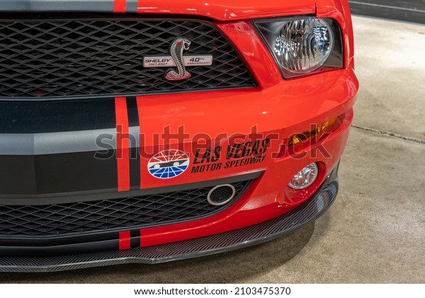 Las\
Vegas, NV - December 13, 2021: Shelby 40th Anniversary Edition\
emblem and Las Vegas Motor Speedway decal on a red with black\
stripe Ford Mustang at the Shelby Heritage\
Center.