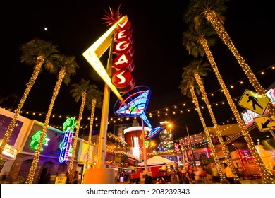 LAS VEGAS, NV - MAY 7, 2014:  View of Fremont Street with vintage lit Vegas sign in Las Vegas Nevada.