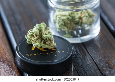 LAS VEGAS, NV - OCTOBER 22, 2016. Wiz Khalifa Kush Brand Of Marijuana Purchased From Dispensary Close Up In Glass Jar On Wood Table.