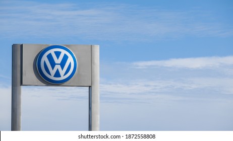 Las Vegas, NV, USA 12-10-2020: Signpost of Volkswagen dealership. Captured on a fine day at the VW Autonation franchise on W. Sahara Avenue. Blue sky with clouds in the background.