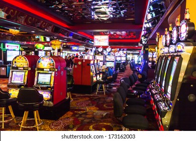 Las Vegas, NV, USA - Circa July 2013: People Playing Slot Machine Games Inside Casino Royale Hotel.