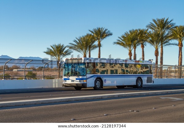 Las Vegas, NV, USA – February 17, 2022: McCarran\
Airport bus shuttle on Gilespie Street heading to the Car Rental\
Center in Las Vegas, Nevada.\
