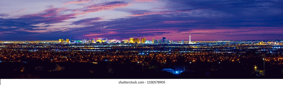 Las Vegas strip night city skyline panorama with strip hotels and casinos and old Vegas lights.