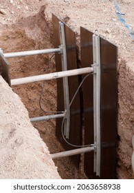 Las Vegas, United States-October 23, 2021:  Shoring In An Excavation Trench, Close-up Showing Hydraulic Lines.  Temporary Shoring During Underground Utility Construction.