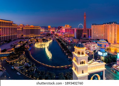 LAS VEGAS, USA - CIRCA JANUARY 2021: High Angle View Of Fountain Show And Las Vegas Skyline In Nevada At Sunset, USA