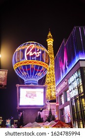 Las Vegas, USA - January 2016 : Balloon and Eiffel Tower of the Paris Las Vegas hotel and casino located on the Las Vegas Strip in Paradise, Nevada at night