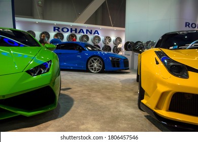 Las Vegas, year 2017: Front view of a green Lamborghini Huracan, yellow Ferrari 488 and behind a blue Audi R8. Supercars exhibited.