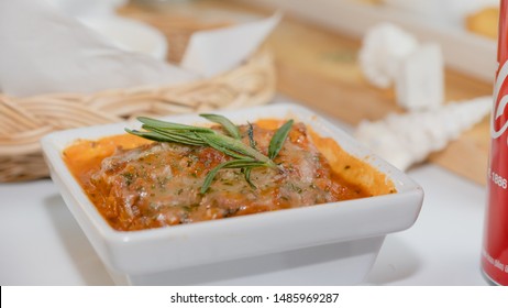 lasagna horizontal view with shell in background