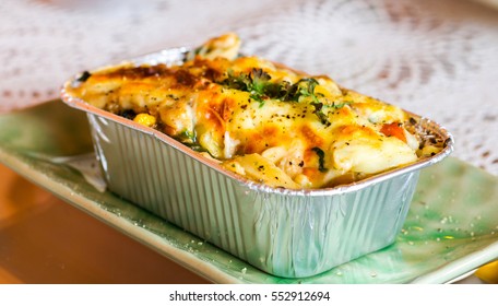 Lasagne Ready Meal In Foil Container On The Table