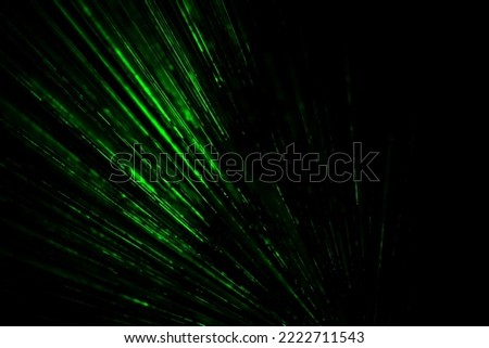 Laser beams in dark. Green rays on black background. Light music bright color. Laser radiation.