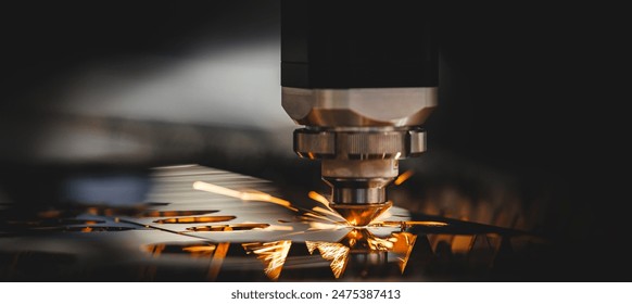 Laser CNC cut of metal with light spark. Industry background banner with copy space, modern technology industrial - Powered by Shutterstock