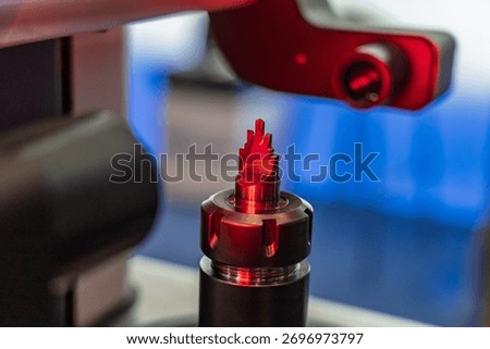 Laser CNC tool measurement machine accurately measuring the length and diameter of cutting machining tools, precision equipment used in workshops and industrial manufacturing environments.