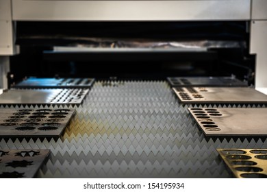 Laser Cutter Cutting Metal Plates In A Factory