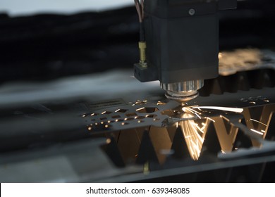 The Laser Cutter Machine While Cutting The Sheet Metal With The Sparking Light