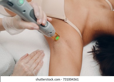 Laser epilation of armpits and cosmetology. Hair removal cosmetology procedure. Laser epilation and cosmetology. Cosmetology and SPA concept.