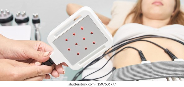 Laser Lipo Equipment. Cosmetic Fat Reduce Treatment. Woman In Medicine Salon. Anti Cellulite Procedure.