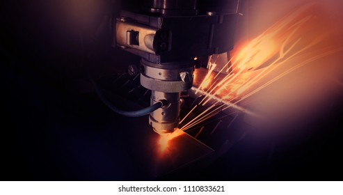 Laser machine, cuts metal, sparks