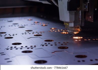 laser machine cutting of sheet metal. Sparks fly from laser by automatic cutting CNC, PLC machine. fabricate work, factory, production