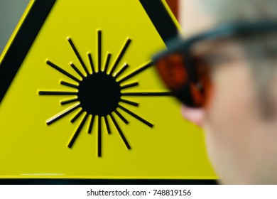 Laser Safety Sign And Safety Glases In Lab