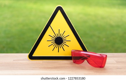 Laser safety sign and safety glasses