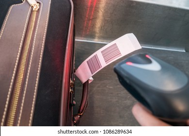 Laser scanner barcode reader scanning for loading luggage bag in the airport