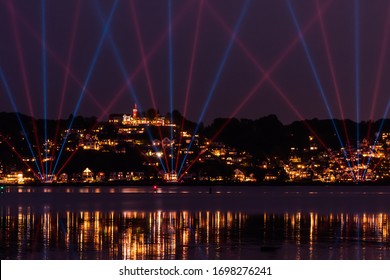 Laser show in front of the Hamburg Suellberg in Blankenese at night