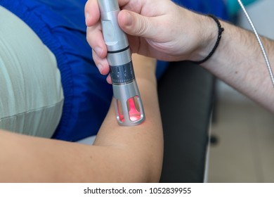 Laser Therapy In Hand Used To Treat Pain. Selective Focus