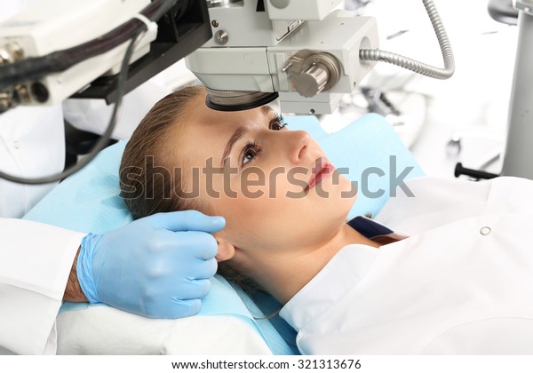 Laser vision correction. A patient in\
the operating room during ophthalmic surgery\
