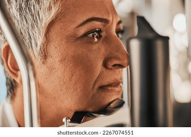 Laser, vision or senior woman in eye exam for eyesight at optometrist office in assessment or consultation. Face of mature female customer testing or checking iris, glaucoma or retina visual health - Powered by Shutterstock