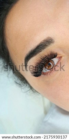 Lash extensions in beauty salon macro eye top view 