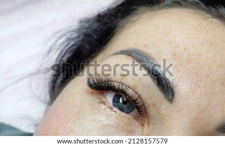 Lash extensions macro eye top view . High quality photo