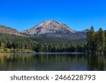 Lassen Peak seen from Manzanita Lake in  Lassen Volcanic National Park : California, USA