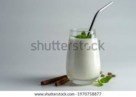 lassi, lassie - indian yogurt drink with spice on white background