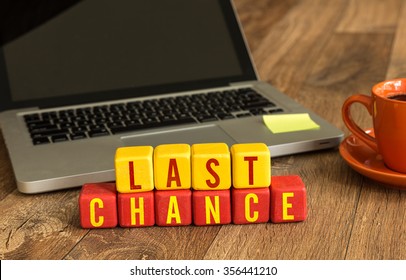 Last Chance Written On A Wooden Cube In A Office Desk