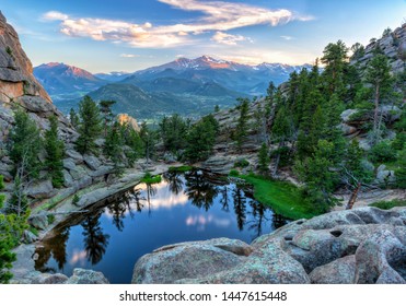 The last evening sunshine hits Longs Peak and The Crags  above Gem Lake in Rocky Mountain National Park, Estes Park, Colorado - Powered by Shutterstock