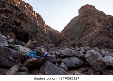 The last of the famous scooters of the Fish River Canyon, with the top of the cliffs catching the first morning light - Powered by Shutterstock