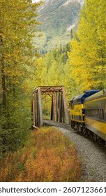 America’s last flag stop train is approaching a Pratt truss bridge on the route to Hurricane gulch bridge, Alaska
