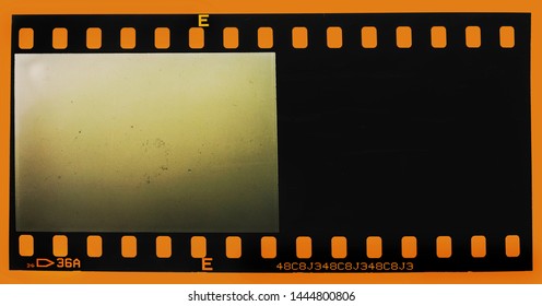 last frame of 35mm film strip on orange background, 135 film material