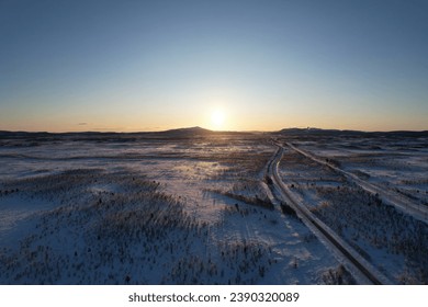 Last light of day stretches over the tranquil, frosty landscape of Krokvik. - Powered by Shutterstock