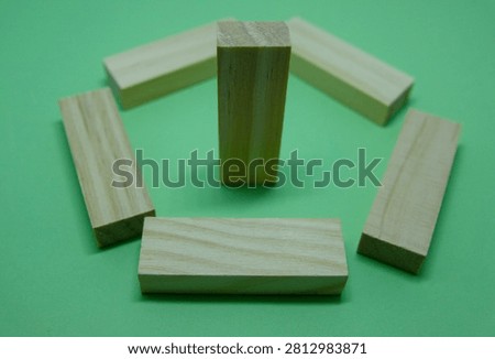 Last man standing, concept using wooden blocks. Stay persistent