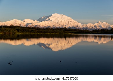 The Last Of The Midnight Sun Glows Orange On The Slopes Of Denali In Alaska