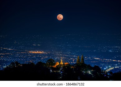 the Last Penumbral Lunar Eclipse in 2020 over Wat Phrathat Doi Suthep Temple , Chiang mai , Thailand - Powered by Shutterstock