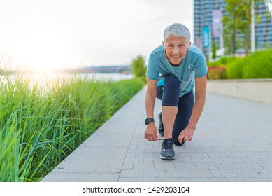 Last prep before the run. Woman wearing sport shoes. Woman wearing sport shoes. Female runner tying her shoes preparing for a jog. Getting ready for running  - Powered by Shutterstock